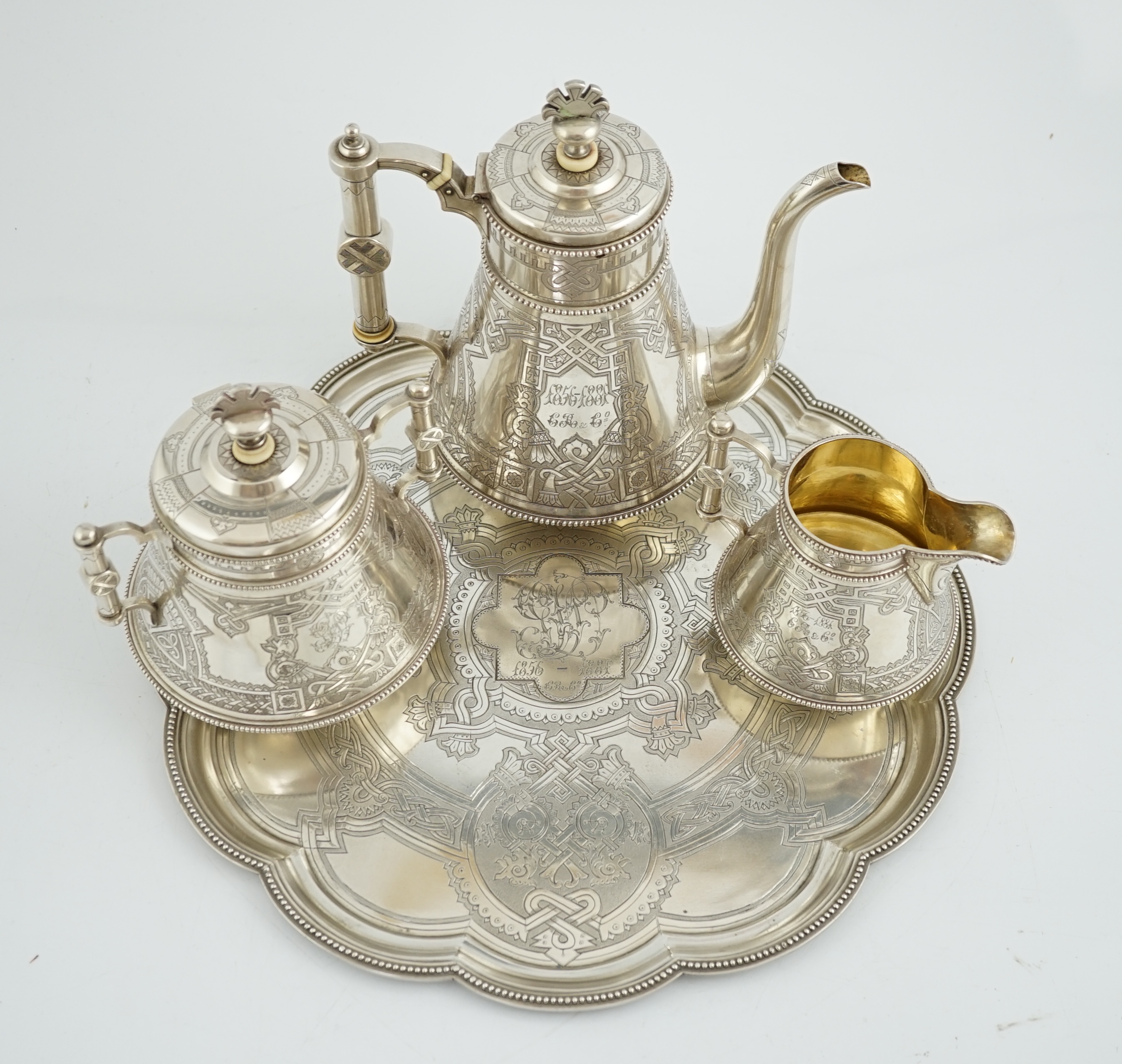 A late 19th century Russian three piece 84 zolotnik silver coffee set, with matching cusped circular tray, CITES submission reference: 6NJYTYTT